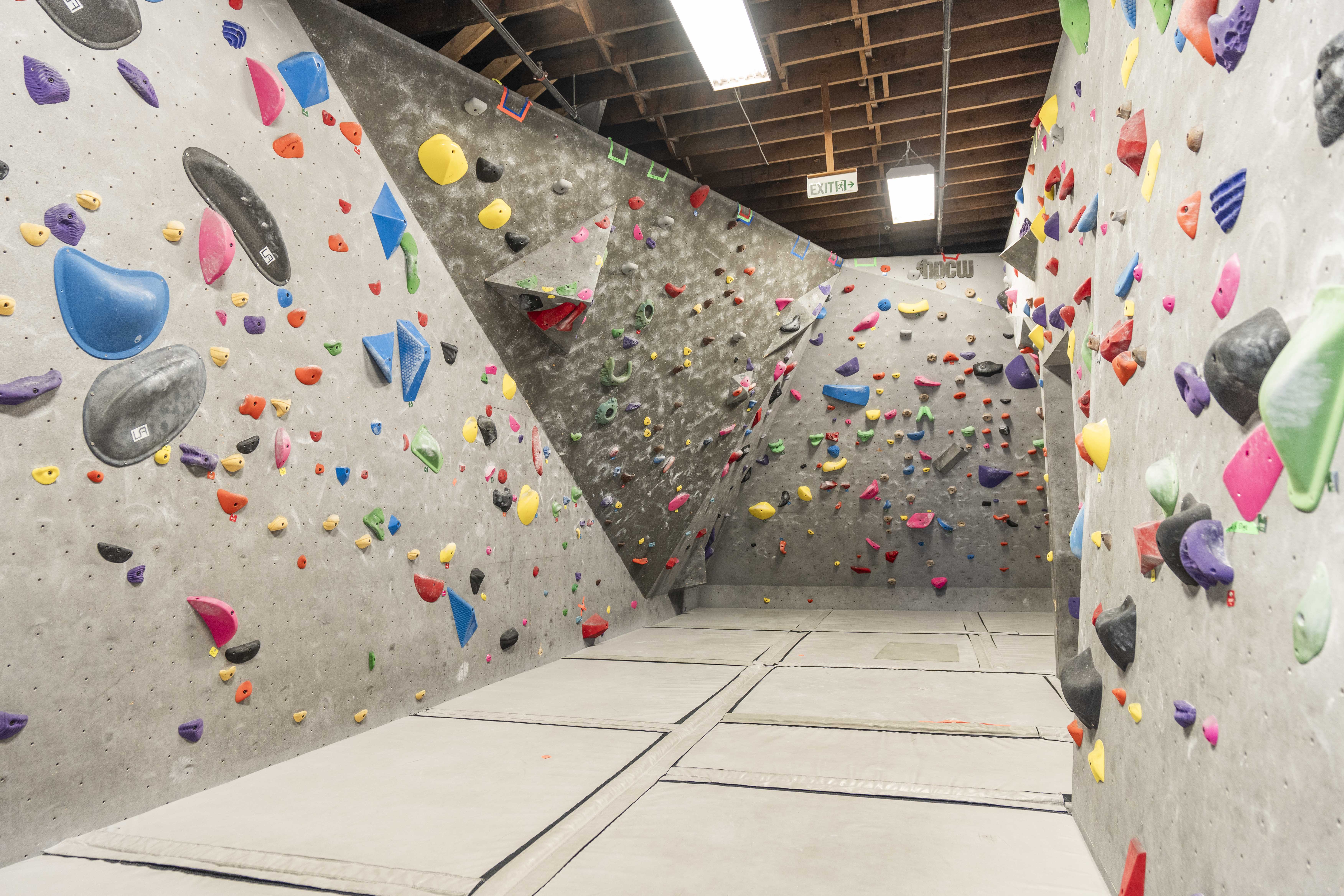 Top Out's bouldering walls and padded floor